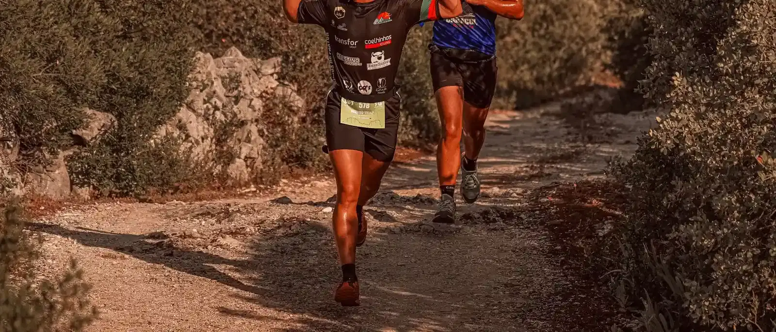 Runners crossing a finish line at the end of a race
